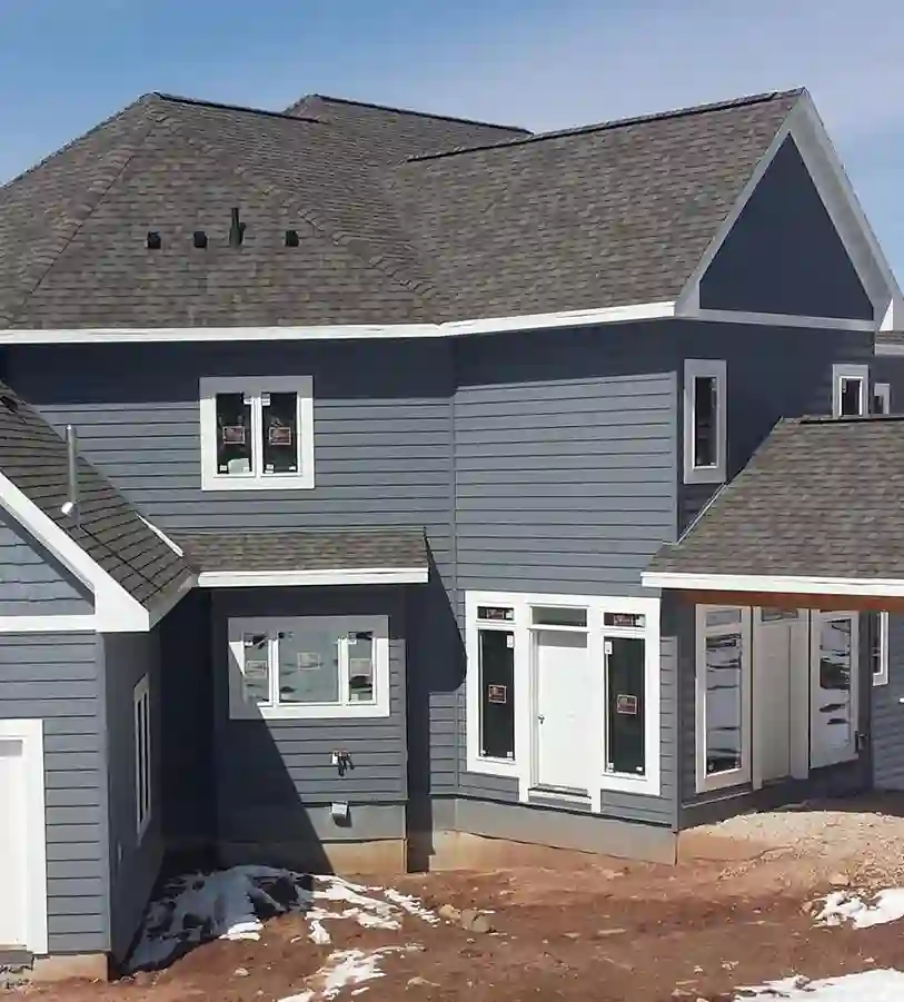 A residential house showing siding and rooftop.